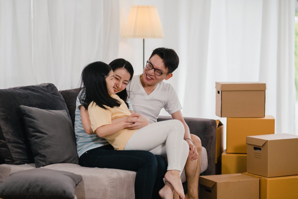 How to avoid paying lenders mortgage insurance family celebrating moving day
